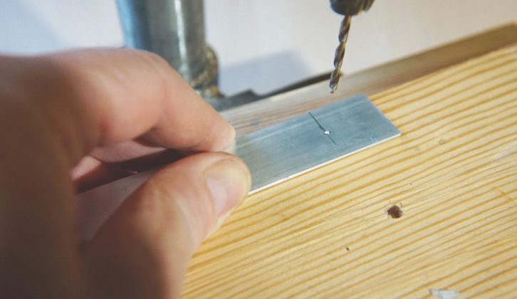 A pillar or hand-held drill can be used to make rivet holes