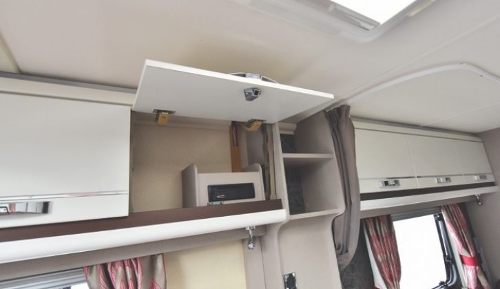 A CD/radio unit is handily located in an overhead locker in the kitchen