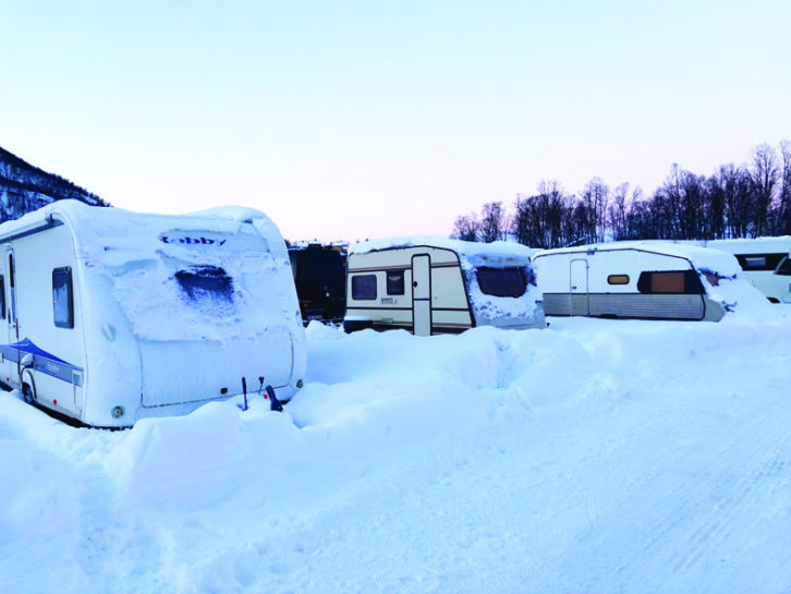 Caravans parked up and surrounded by snow