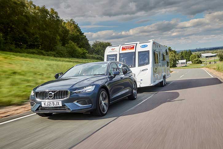 Volvo V60 Recharge T6 AWD Plus towing a caravan