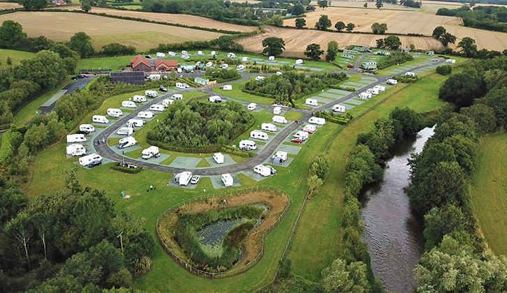 Caravans and motorhomes pitched up at Ludlow Touring Park