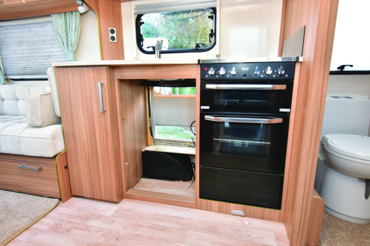 A new fridge was being fitted in the kitchen, which has a dual-fuel hob and a circular stainless-steel sink