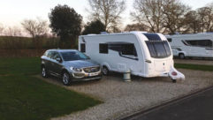 A parked caravan and car