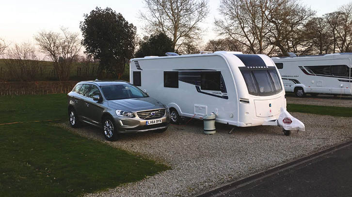 A parked caravan and car