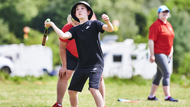 Boy playing rounders