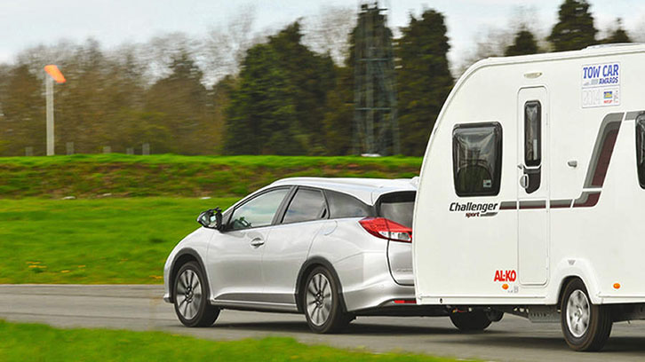 A car towing a caravan