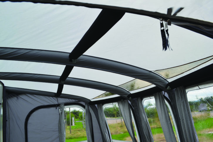 Add any reinforcing poles or beams once the awning structure is firmly in place