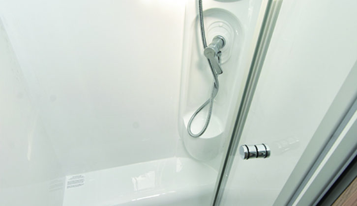 Luxurious and separate moulded shower cubicle is well lit and a good size