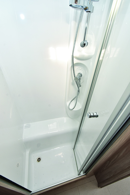 Luxurious and separate moulded shower cubicle is well lit and a good size