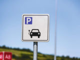 EV charging symbol on a signpost