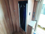 Opposite the kitchen is the Series 10 Dometic two-way fridge and more storage