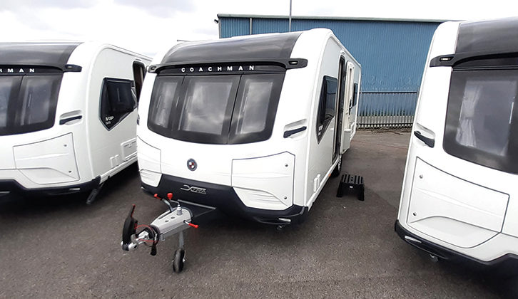 Three Coachman caravans parked on a forecourt