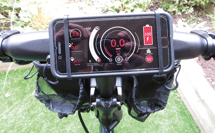An iPhone mounted on the GoCycle G4 handlebars