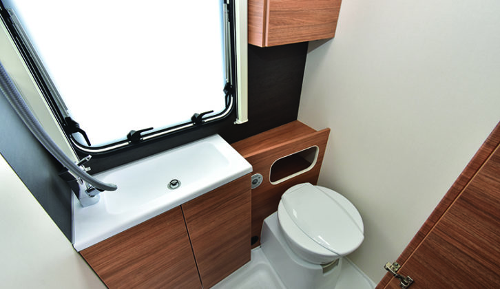 Compact washroom feels very upmarket, with a Dometic toilet and generous storage