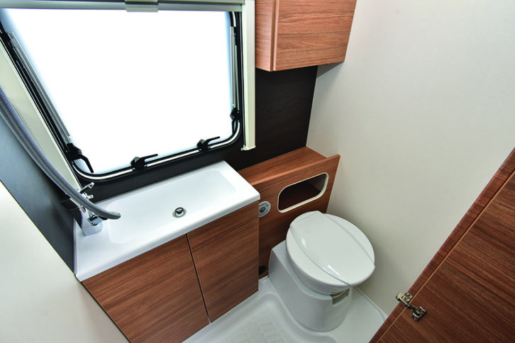 Compact washroom feels very upmarket, with a Dometic toilet and generous storage