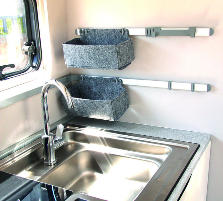 Adria's signature storage system is usefully located next to the large sink