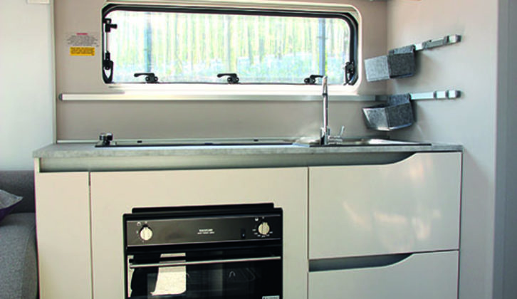 Tiber's stylish kitchen is compact and well equipped, although worktop might be a bit limited