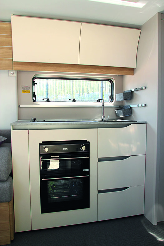 Tiber's stylish kitchen is compact and well equipped, although worktop might be a bit limited