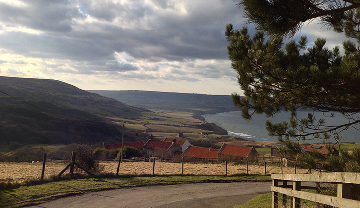 The sea in the distance at Ravenscar as you round a picturesque bend in the road