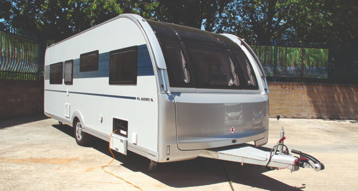 An Adria Adora TIber on a forecourt