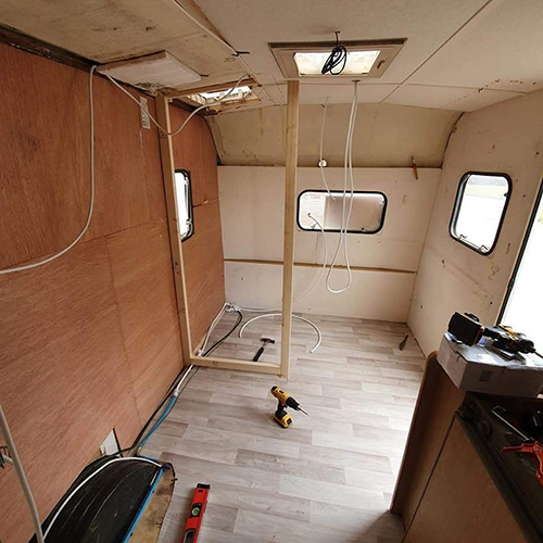 A caravan stripped back to its shell