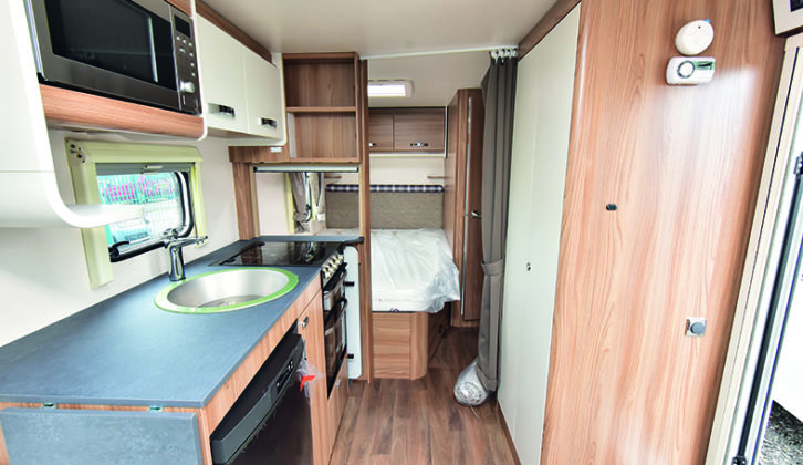 Large wardrobe provides plenty of hanging space, and bedroom has a curtain partition