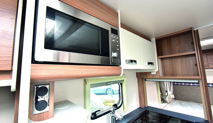 Kitchen is compact but well-equipped, and the microwave is a welcome addition