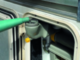 Replenishing the flush tank on a Thetford toilet