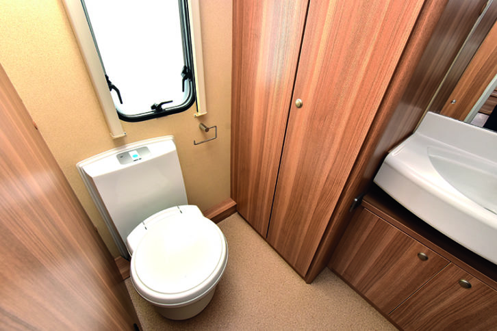 Excellent end washroom has Thetford electric-flush toilet, sizeable wardrobe, window, and a spacious shower cubicle