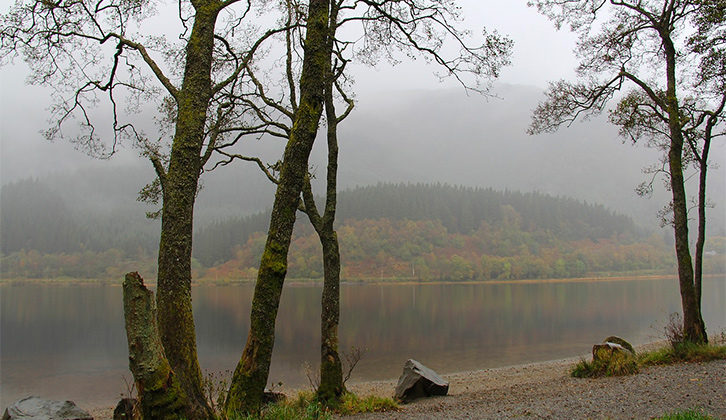 Looking out over a Loch with mist rolling in