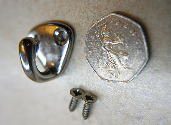 The coat hook, a 50p and two screws