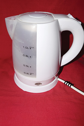A 1kW electric kettle with four cable ties