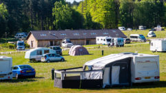 A campsite, with motorhomes and caravans pitched up