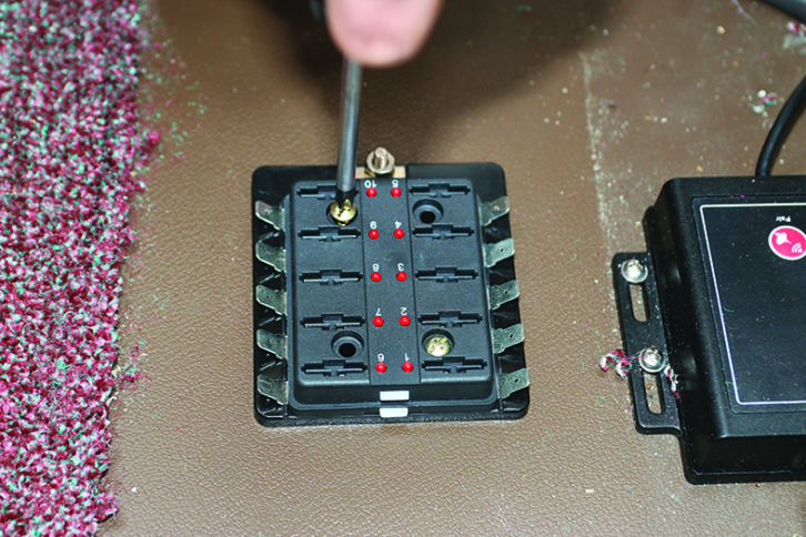 The fuse box and the earthing block were secure to the caravan floor with screws