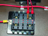 13. The spade connectors were plugged into the fuse box and fuses added. Note the LEDs