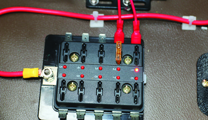 13. The spade connectors were plugged into the fuse box and fuses added. Note the LEDs