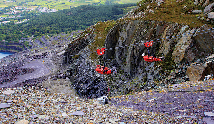 Visitors can rocket down a mile-long steel cable above an old slate quarry at Zipworld