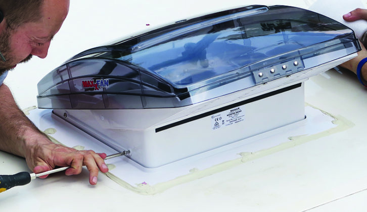 Now screw the MaxxFan to the roof flange - make sure the MaxxFan is open and the exhaust louvres are facing towards the rear of the vehicle