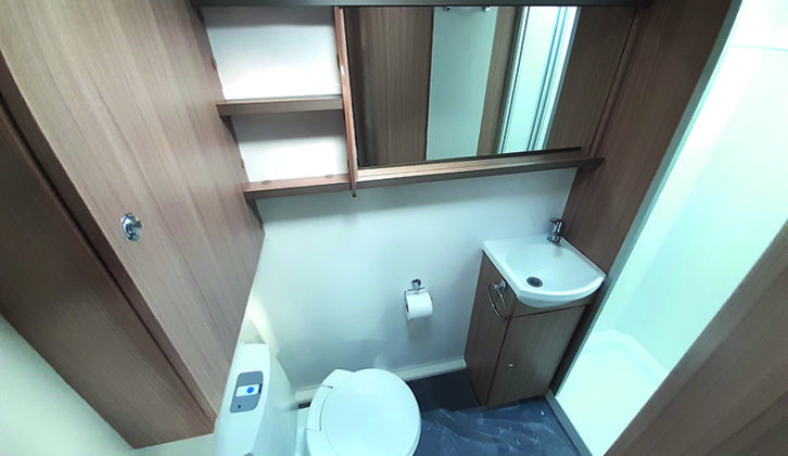 Washroom benefits from a large mirror, and a second roof light in the shower cubicle