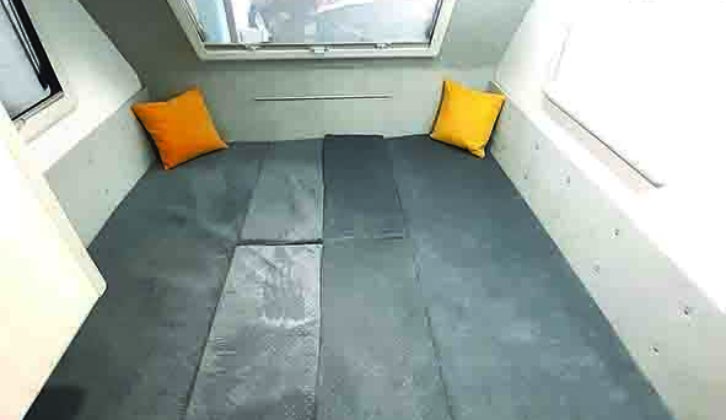 Settees make up into a 1.9m x 1.9m double bed, but base cushions are not split