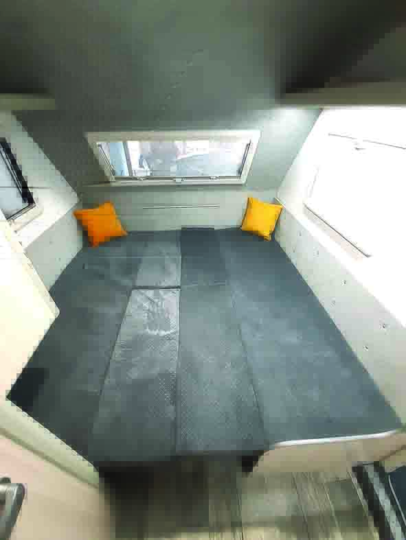 Settees make up into a 1.9m x 1.9m double bed, but base cushions are not split