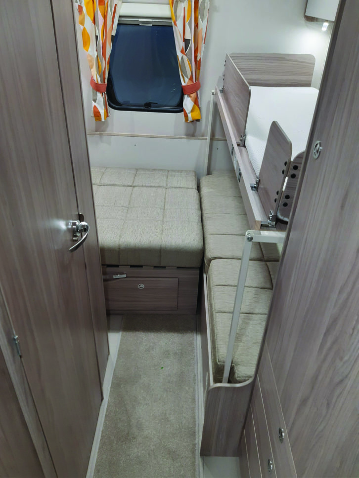 Seating in rear lounge makes up into a fairly small double, with pull-out bunk above