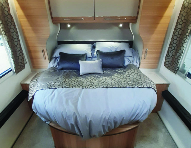 Opulent island bed at the rear is five feet wide and superbly comfortable