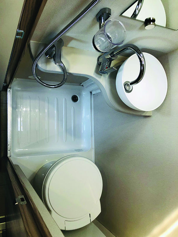 Washroom provides a Thetford swivel toilet, handbasin and Ecocamel shower head