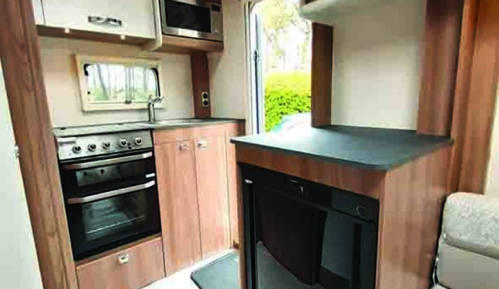 Work surface above the fridge is useful for food prep, or you could position a TV here