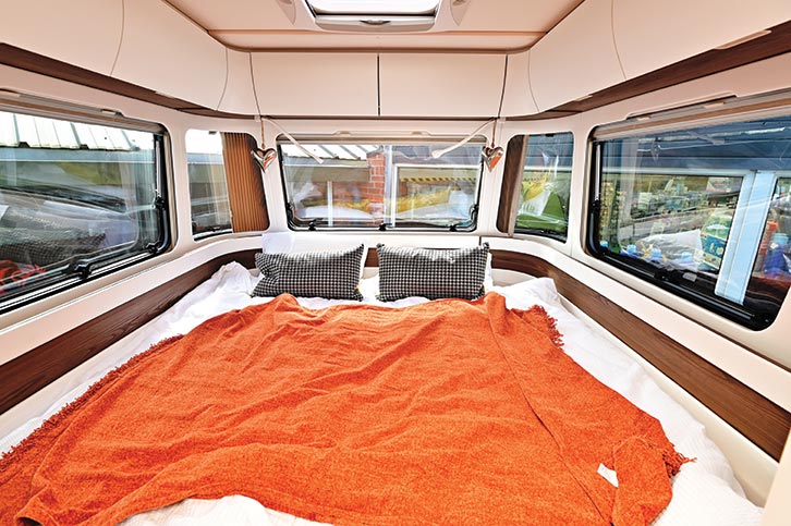The king-sized bed has good overhead locker storage