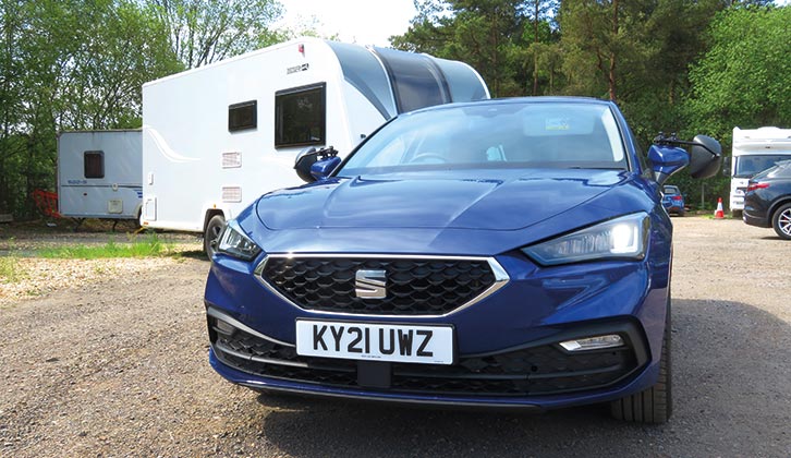 The Seat Leon 1.0 eTSI SE Dynamic towing a caravan