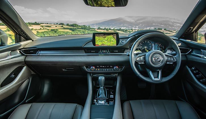The Mazda has an attractive-looking interior, with a sporty three-dial dashboard