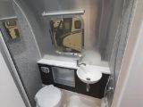 Airplane-style washroom provides excellent headroom and a sizeable handbasin