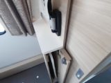 The foldaway table, stowed in its slot